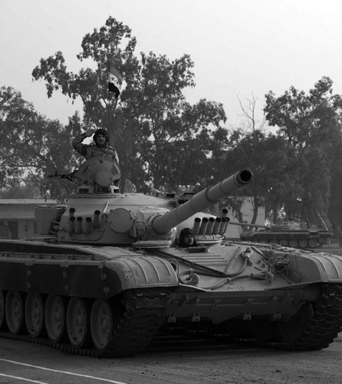 2d Brigade soldiers on parade in refurbished T-72 tanks and BMP armored personnel carriers in a ceremony at Taji Military Base 15 miles north of Baghdad, 17 November 2005.
